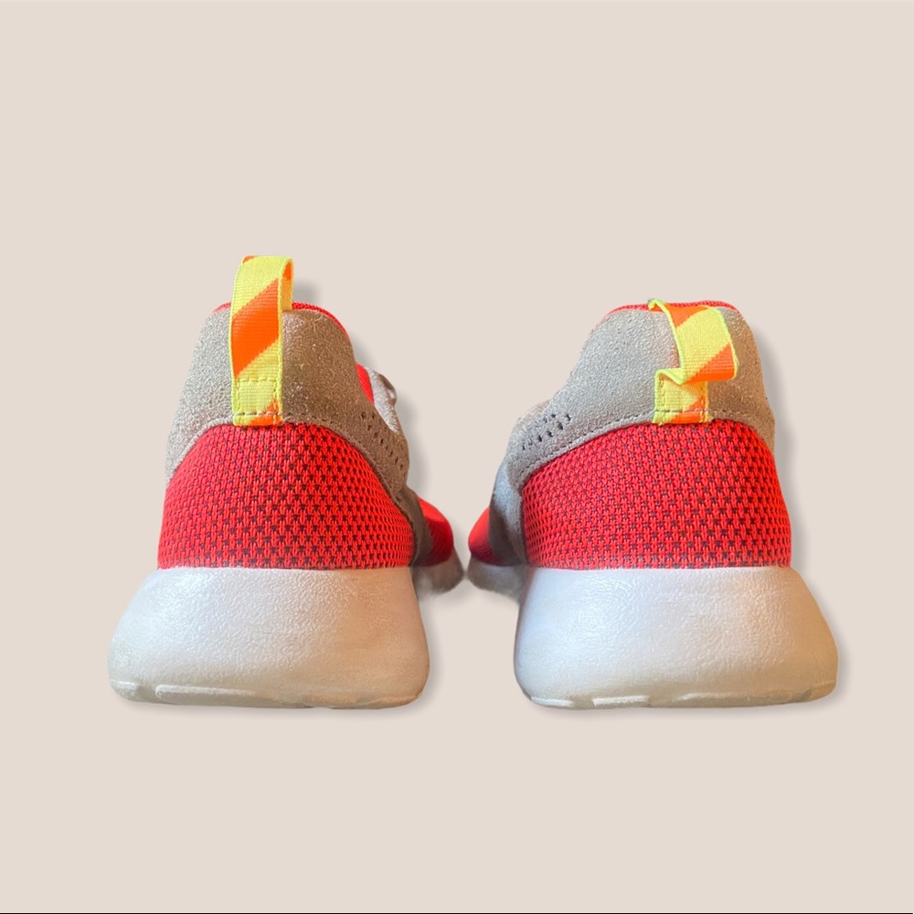 Red and grey suede Nike Roshe